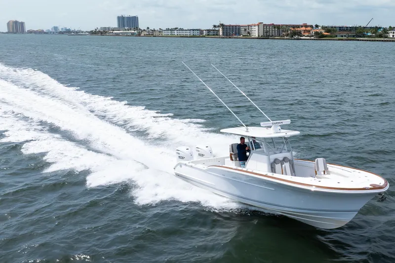 Slide: The Image of 2026 Buddy Davis 34 Center Console cruising on open water, showcasing sleek design and performance. - 40