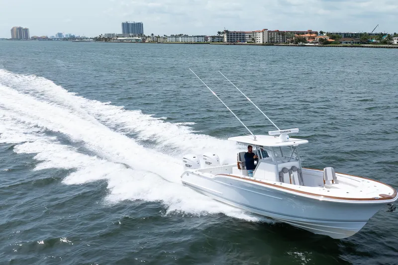 Slide: The Image of 2026 Buddy Davis 34 Center Console boat cruising on open water. - 41