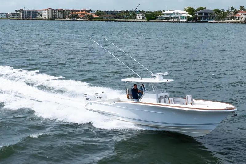 Slide: The Image of 2026 Buddy Davis 34 Center Console boat cruising on open water. - 42