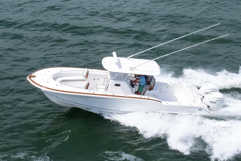 Slide: The Image of 2026 Buddy Davis 34 Center Console boat cruising on open water. - 43