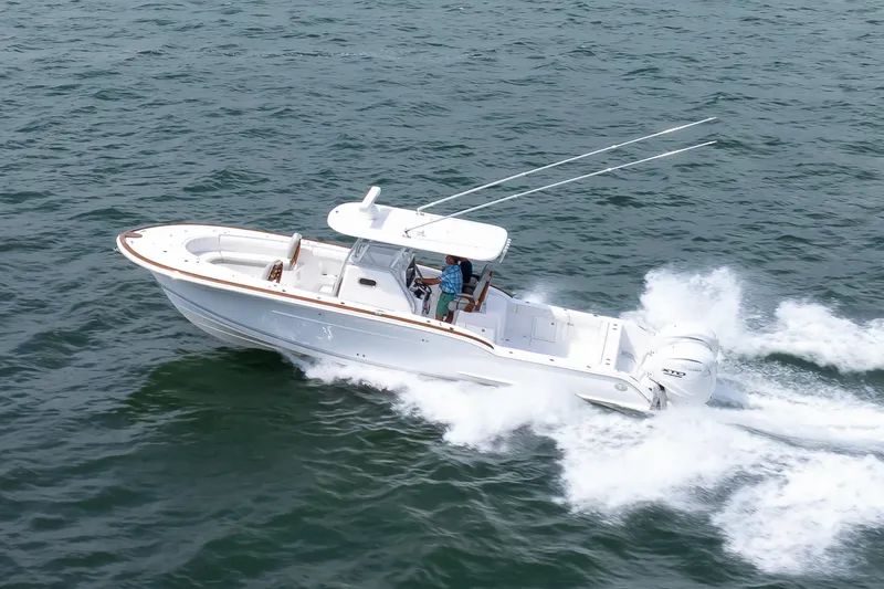 Slide: The Image of 2026 Buddy Davis 34 Center Console boat cruising on open water. - 48