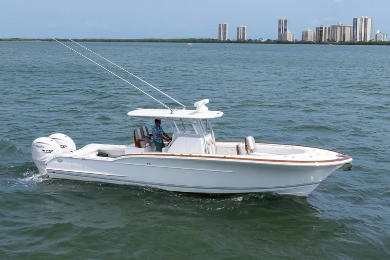 Slide: The Image of 2026 Buddy Davis 34 Center Console boat cruising on open water. - 53