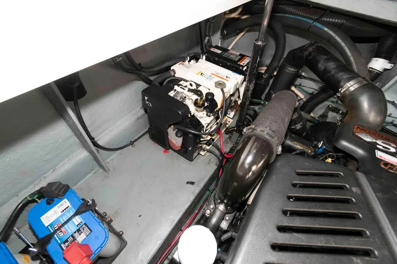 Slide: The Image of Engine compartment of a 2004 Sea Ray 340 Sundancer boat, showing mechanical components. - 19
