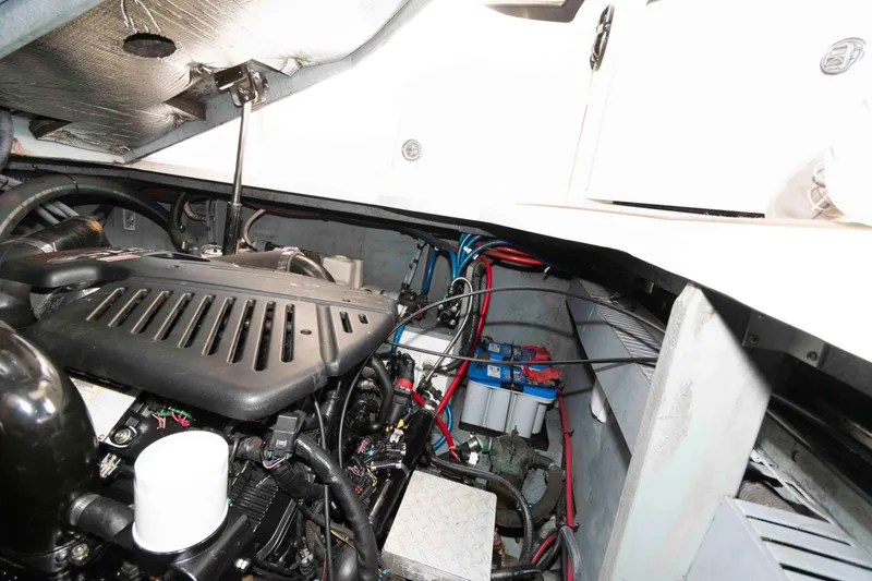 Slide: The Image of Engine compartment of a 2004 Sea Ray 340 Sundancer boat, showing mechanical components. - 20