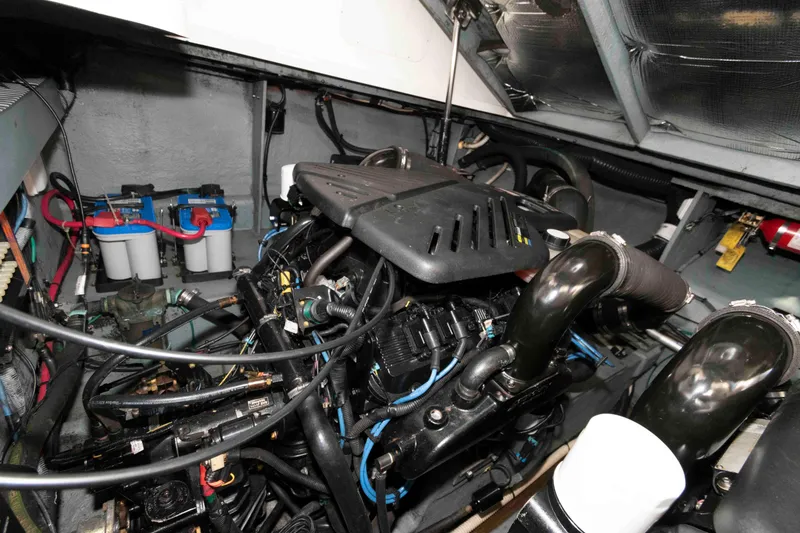 Slide: The Image of Engine compartment of a 2004 Sea Ray 340 Sundancer boat, showing detailed components. - 21