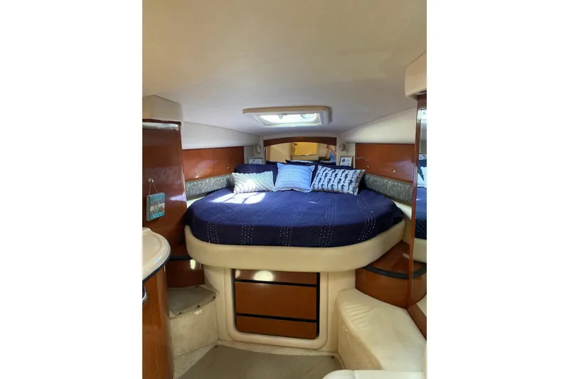 Slide: The Image of 2004 Sea Ray 340 Sundancer docked at marina, surrounded by other boats. - 4