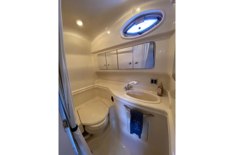 Slide: The Image of 2004 Sea Ray 340 Sundancer cockpit with dual seats, steering wheel, and navigation equipment. - 7