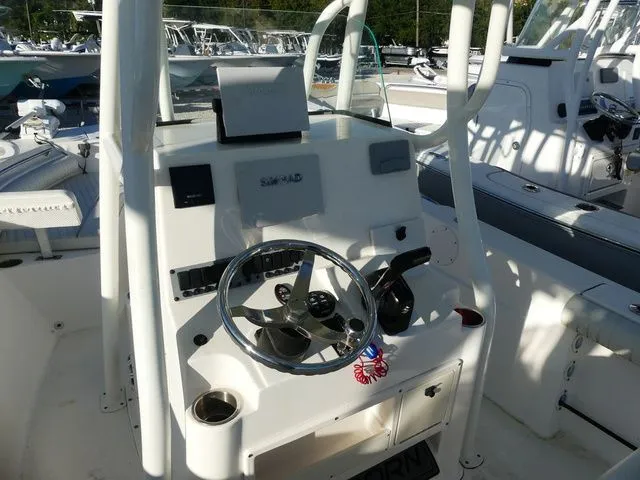 Slide: The Image of 2019 Sea Born LX22 Center Console helm with steering wheel and controls. - 11
