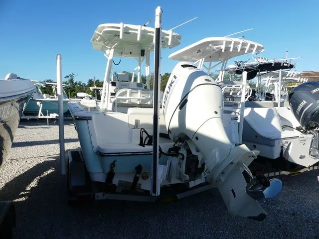 Slide: The Image of Rear view of a 2019 Sea Born LX22 Center Console boat at the dock. - 4