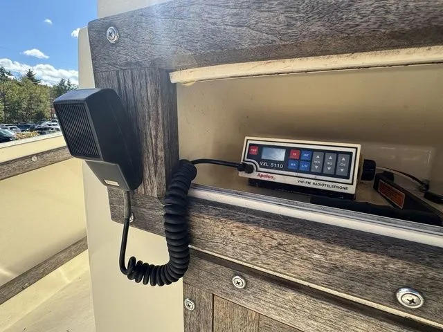 Slide: The Image of Vintage VXL 5110 marine radio on a 1990 Mako 201 boat dashboard. - 13