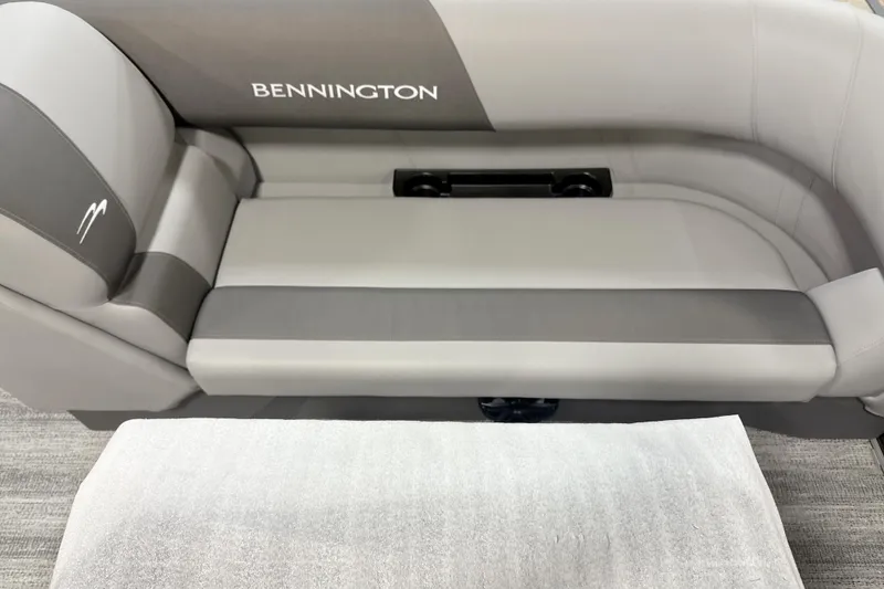 Slide: The Image of 2025 Bennington SSR boat seating, gray and white upholstery, modern design. - 2