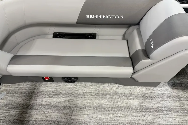 Slide: The Image of 2025 Bennington SSR boat seat with gray upholstery and integrated cup holders. - 4