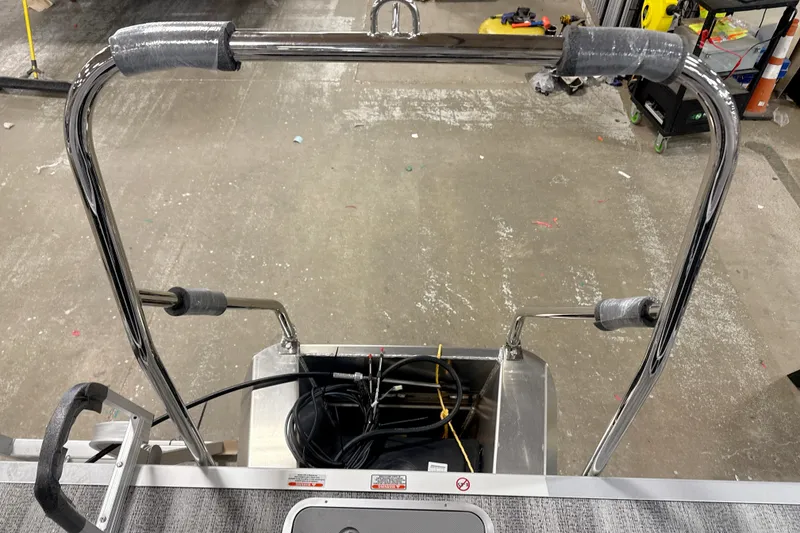 Slide: The Image of 2025 Bennington SSR boat ladder with protective padding in a workshop setting. - 9