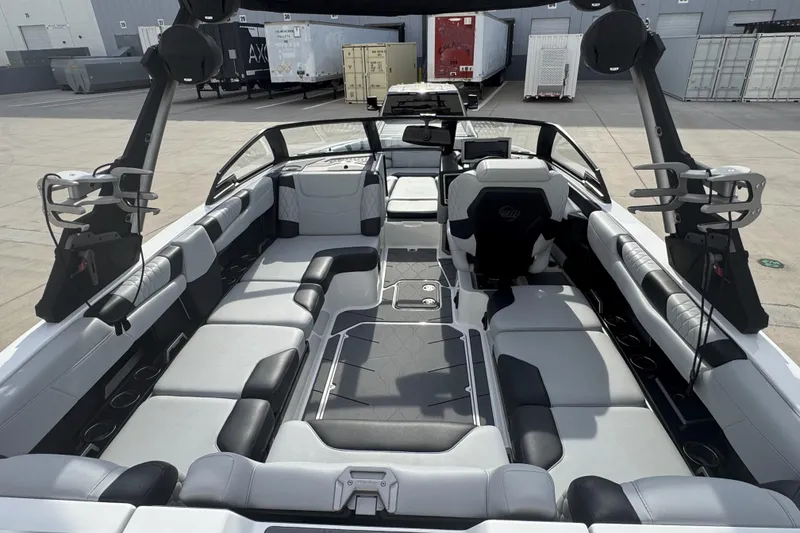 Slide: The Image of 2023 Malibu M220 boat interior with spacious seating and modern design. - 3