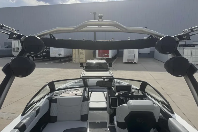 Slide: The Image of 2023 Malibu M220 boat interior with modern seating and advanced dashboard features. - 5