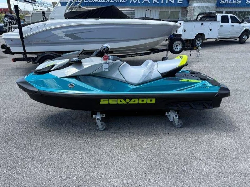 Slide: The Image of 2026 Sea-Doo GTI SE 130 jet ski displayed in parking lot. - 19