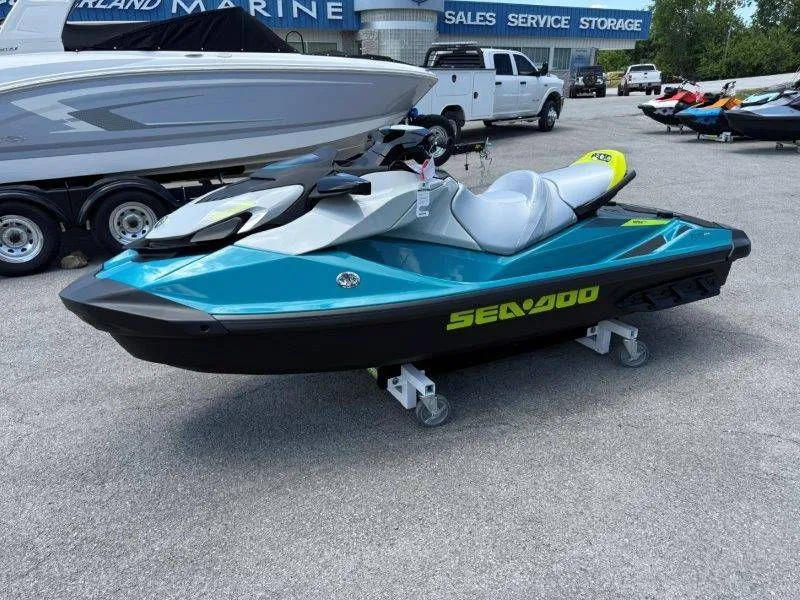 Slide: The Image of 2026 Sea-Doo GTI SE 130 jet ski displayed in parking lot. - 31