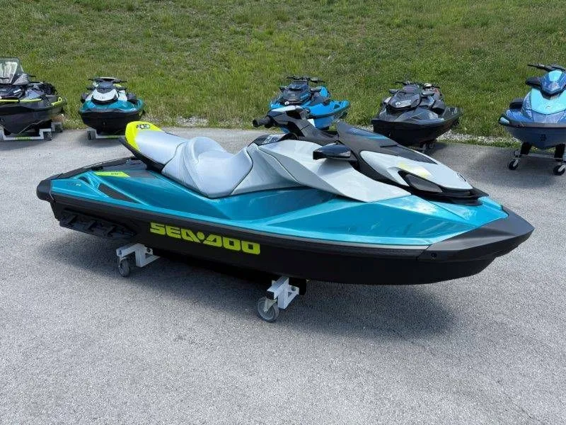 Slide: The Image of 2026 Sea-Doo GTI SE 130 jet ski displayed in parking lot. - 32