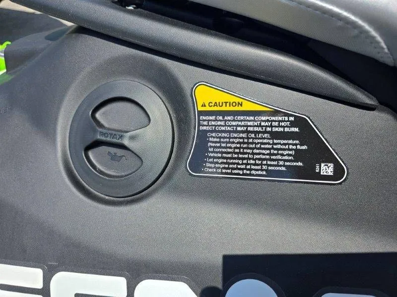 Slide: The Image of Warning label on Sea-Doo Spark Trixx 2026 engine cover. - 16