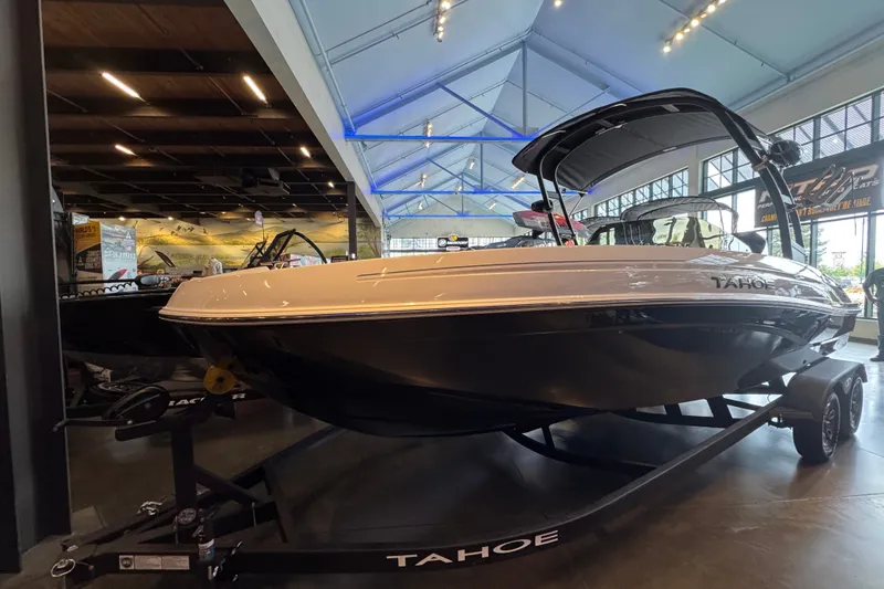 Slide: The Image of 2026 Tahoe T21 boat displayed indoors, showcasing sleek design and modern features. - 1