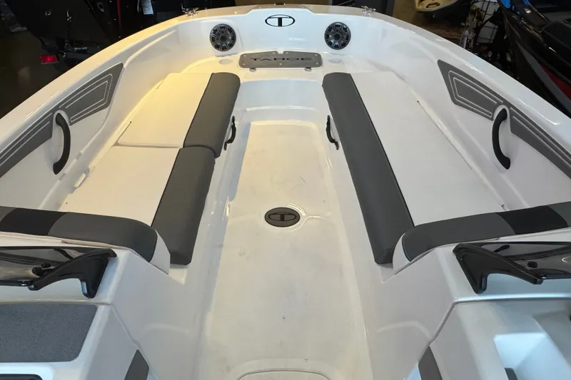 Slide: The Image of 2026 Tahoe T21 boat interior with gray seating and modern design. - 6