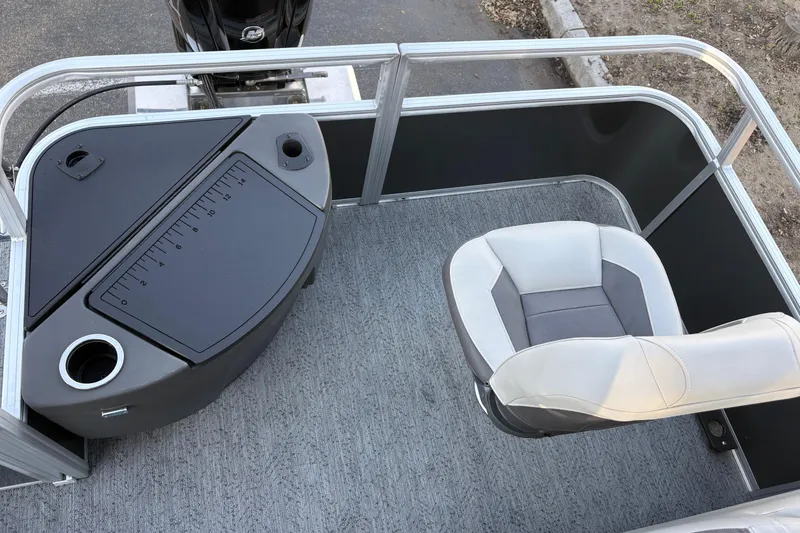Slide: The Image of 2026 Sun Tracker Bass Buggy 18 DLX boat interior with fishing seat and measuring station. - 12