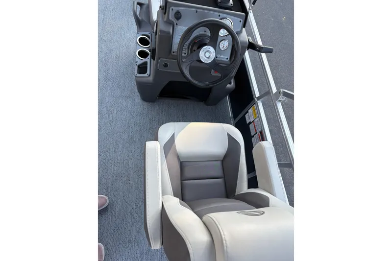 Slide: The Image of Interior view of 2026 Sun Tracker Bass Buggy 18 DLX with steering console and seating. - 15