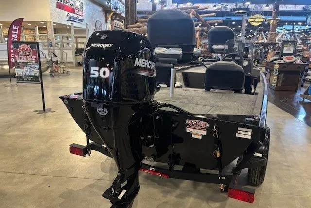 Slide: The Image of 2026 Tracker Bass Tracker Classic XL boat with Mercury 50 engine displayed indoors. - 65