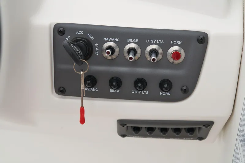 Slide: The Image of Steering console of 2026 Tahoe T18 boat with modern controls and display. - 17