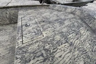 Slide: The Image of 2026 Tracker Grizzly 1860 Utility boat with camouflage pattern deck. - 8