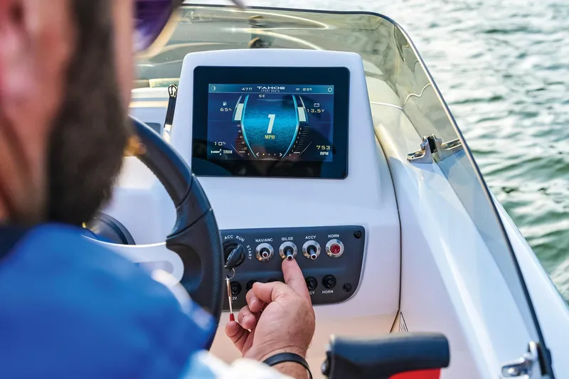 Slide: The Image of Steering console of 2026 Tahoe T16 boat with controls and display screen. - 47