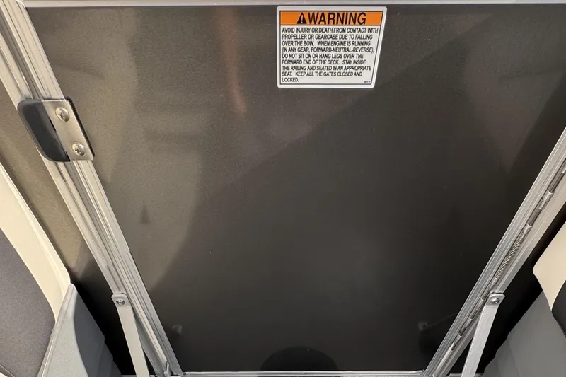 Slide: The Image of 2024 Sylvan 822 LZ boat gate with safety warning label. - 17