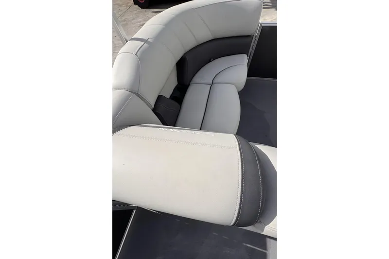 Slide: The Image of 2024 Sylvan 822 LZ boat interior with luxurious gray seating. - 23