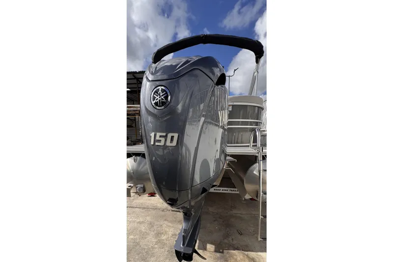 Slide: The Image of 2024 Sylvan 822 LZ pontoon boat with Yamaha 150 outboard motor. - 3