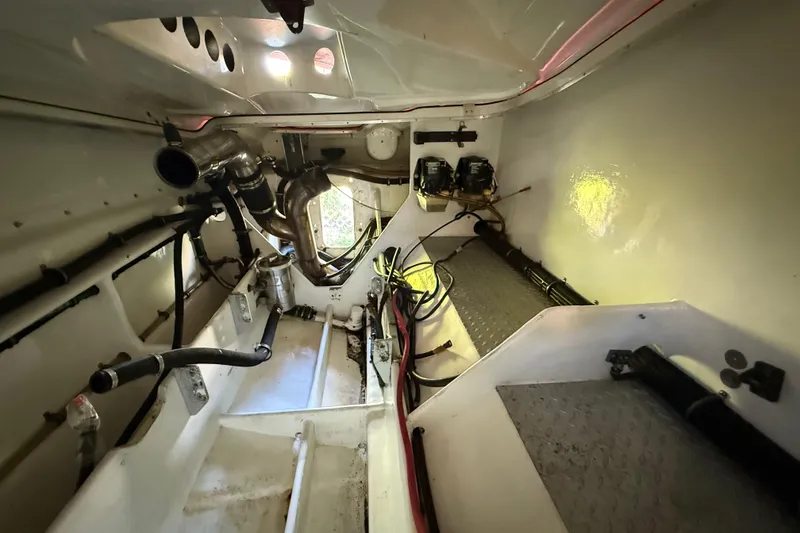 Slide: The Image of Interior view of a 2007 Nor-Tech Supercat 3600 engine compartment, showcasing mechanical components. - 23