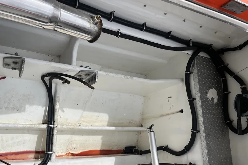 Slide: The Image of 2007 Nor-Tech Supercat 3600 engine compartment with visible wiring and exhaust system. - 28