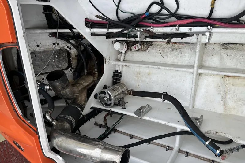 Slide: The Image of Engine compartment of a 2007 Nor-Tech Supercat 3600 with visible pipes and wiring. - 33