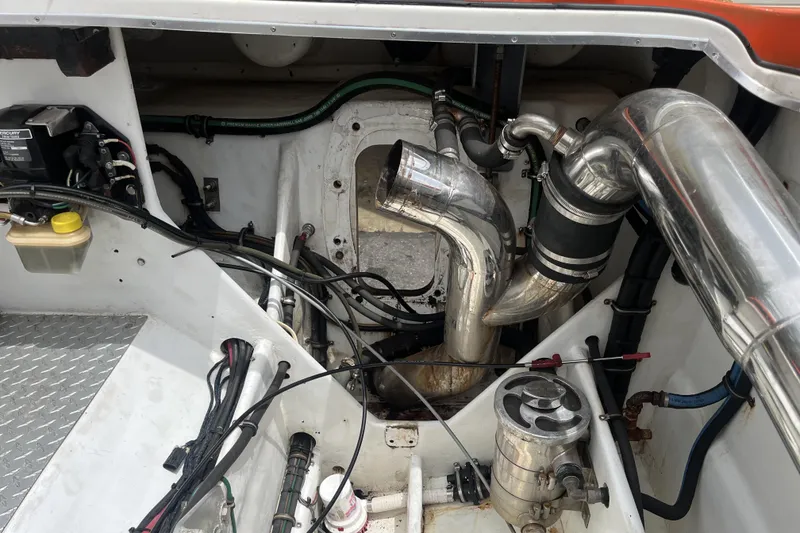 Slide: The Image of Engine compartment of a 2007 Nor-Tech Supercat 3600 with visible wiring and metal components. - 40