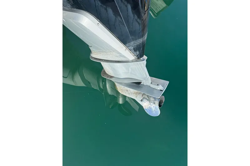 Slide: The Image of 2024 Bayliner Trophy T25 Pilothouse boat propeller in clear water. - 14