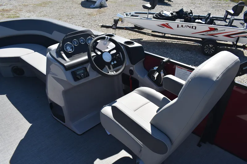Slide: The Image of Interior of 2026 Lowe LS 190 boat with steering console and seating. - 10