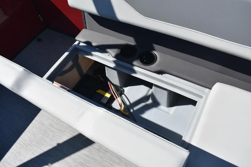Slide: The Image of Storage compartment in 2026 Lowe LS 190 boat with cup holders and wiring. - 12