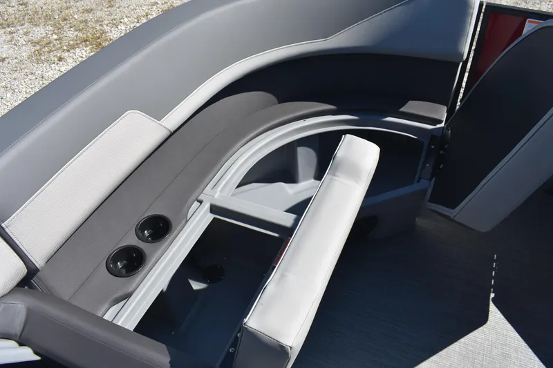 Slide: The Image of 2026 Lowe LS 190 boat interior with open storage compartment and cup holders. - 15