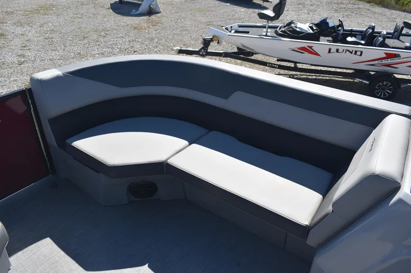 Slide: The Image of Interior seating of 2026 Lowe LS 190 boat, featuring gray cushioned seats. - 17