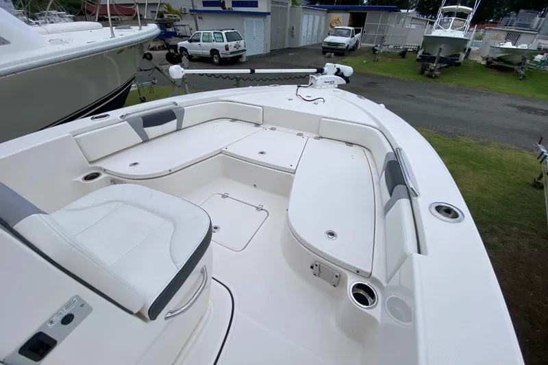 Slide: The Image of 2023 Robalo 226 Cayman boat interior with seating and storage compartments. - 5