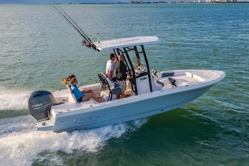 Slide: The Image of Manufacturer Provided Image: 2023 Robalo 226 Cayman boat cruising on the water with passengers. - 7