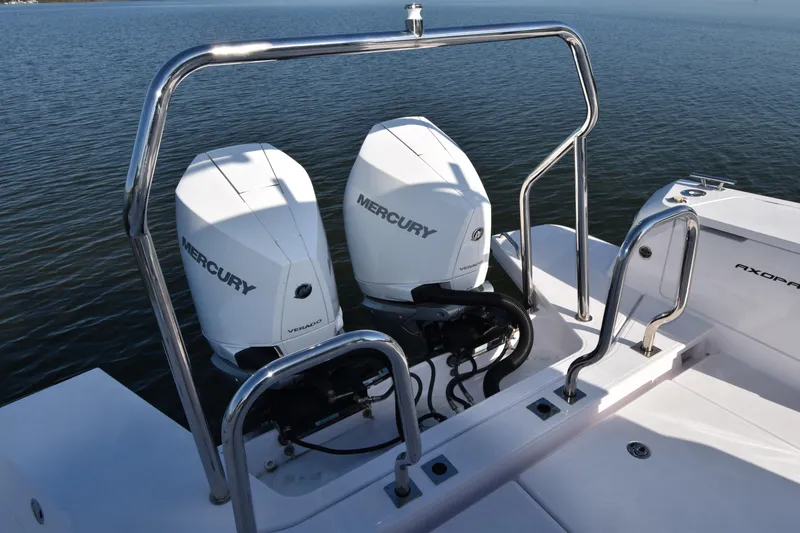 Slide: The Image of 2023 Axopar 37XC Wet Bar with dual Mercury outboard engines on water. - 12