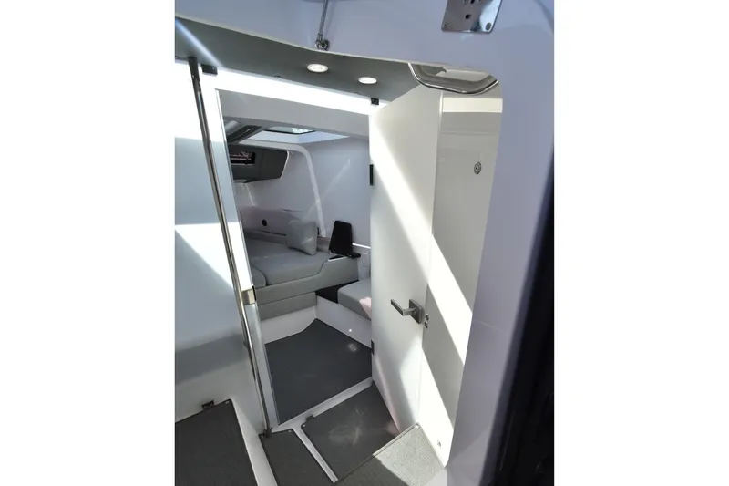 Slide: The Image of Interior cabin of 2023 Axopar 37XC Wet Bar, featuring modern seating and sleek design. - 21