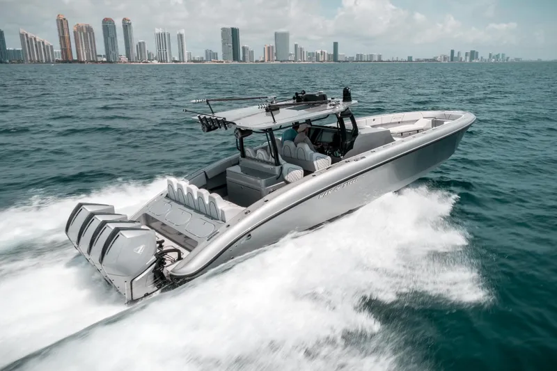 Slide: The Image of 2022 Midnight Express 43 Open boat cruising near city skyline on a sunny day. - 4