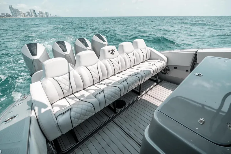 Slide: The Image of Luxury seating on 2022 Midnight Express 43 Open boat with ocean backdrop. - 6