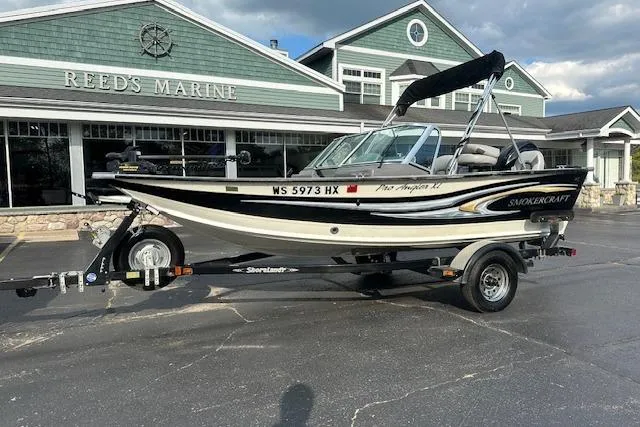 The Image of 2012 Smoker Craft Pro Angler XL 162 boat on trailer at Reed's Marine. - 0